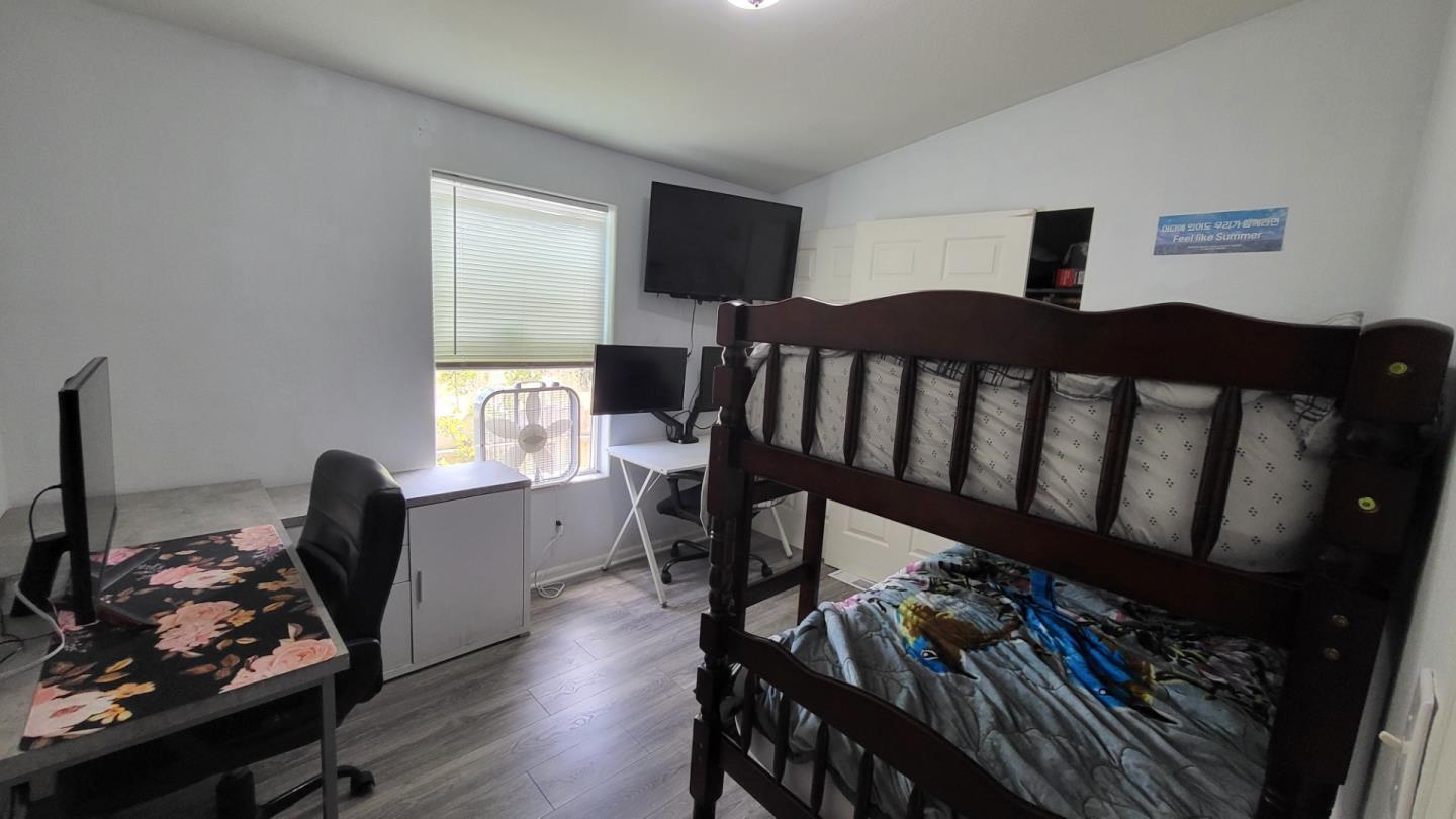 501 South Green Valley Road, Unit 89 Watsonville, CA 95076 - Photo 7 of 12 a bedroom with furniture and a window