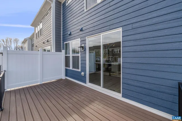 a view of a balcony with wooden floor