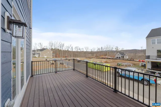 a view of kitchen with wooden floor and electronic appliances
