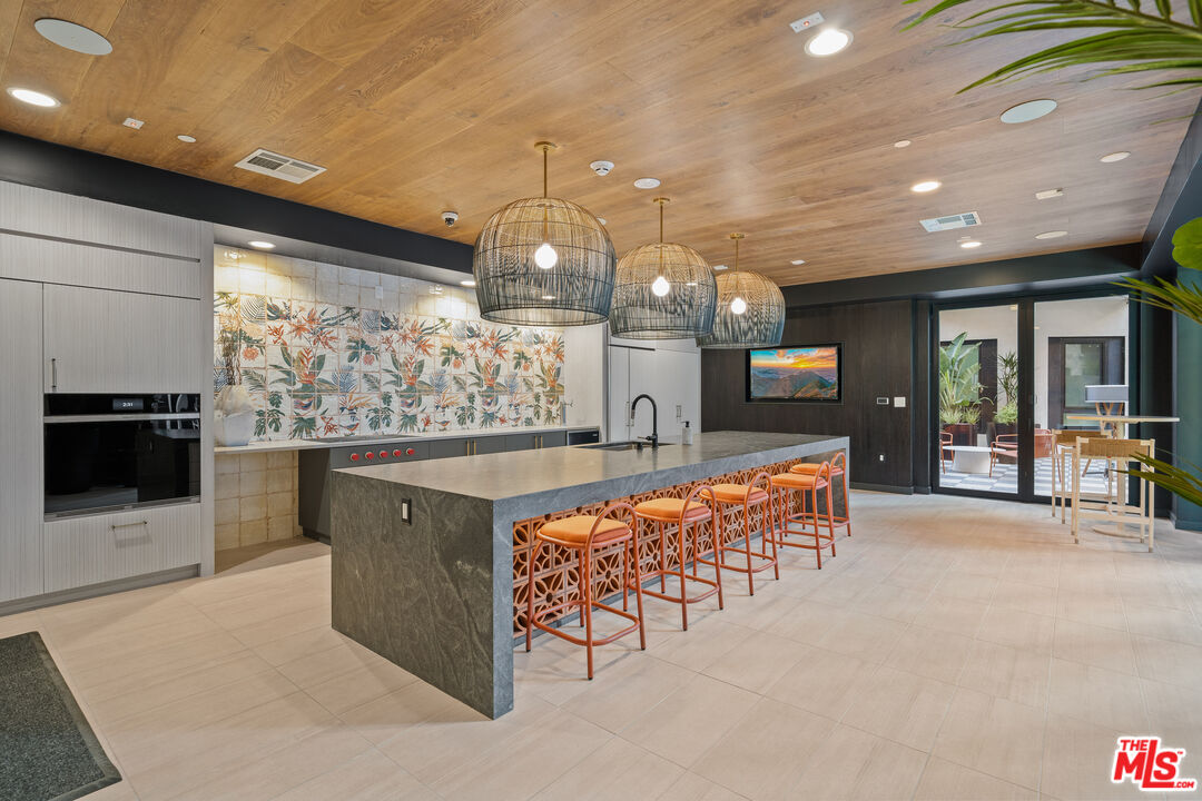 250 East Broadway, Unit 715 Long Beach, CA 90802 - Photo 29 of 44 a large hall with stainless steel appliances a large counter top