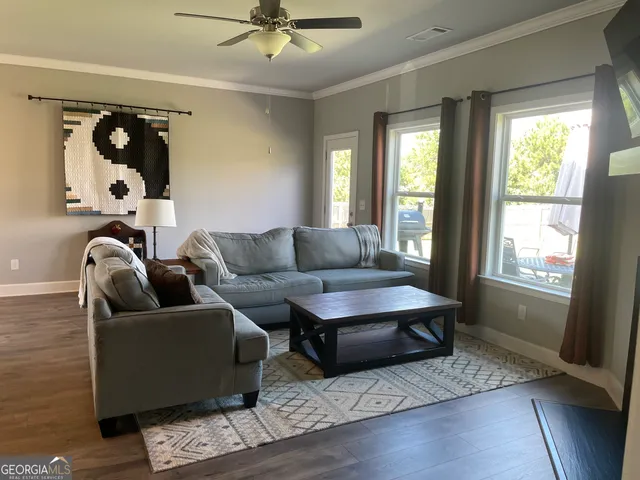 a living room with furniture and a window