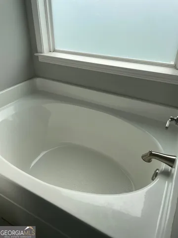 a close up of a bathtub in a window