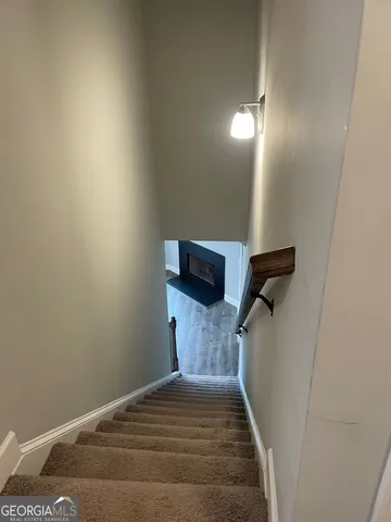 a view of a livingroom with wooden floor and a window