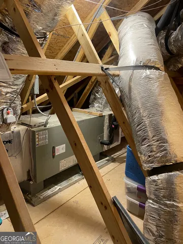 a view of a chairs and table in the backyard