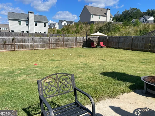 a view of a backyard with potted plants