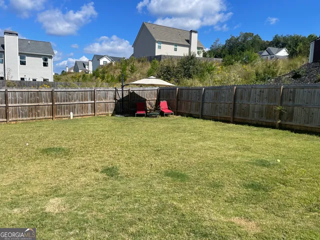 a view of a field with trees