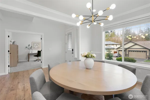 a dining room with furniture and window