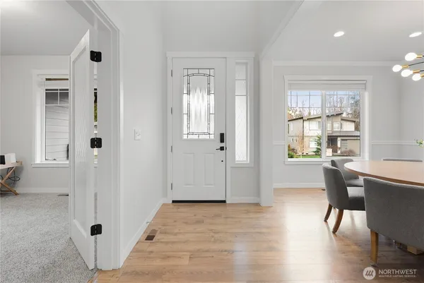 a view of a livingroom with furniture window and wooden floor