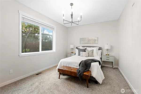 a bed room with a bed and a window