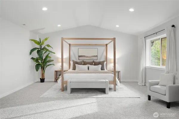 a bedroom with bed and a couch