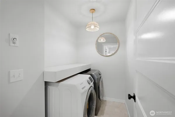 a view of storage and utility room with racks on the wall