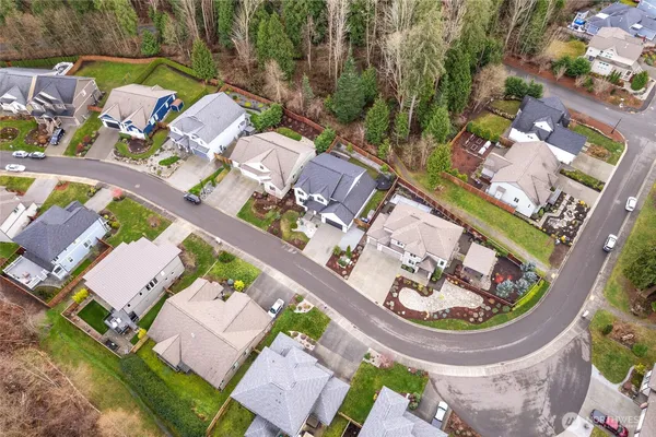 an aerial view of a house with a swimming pool