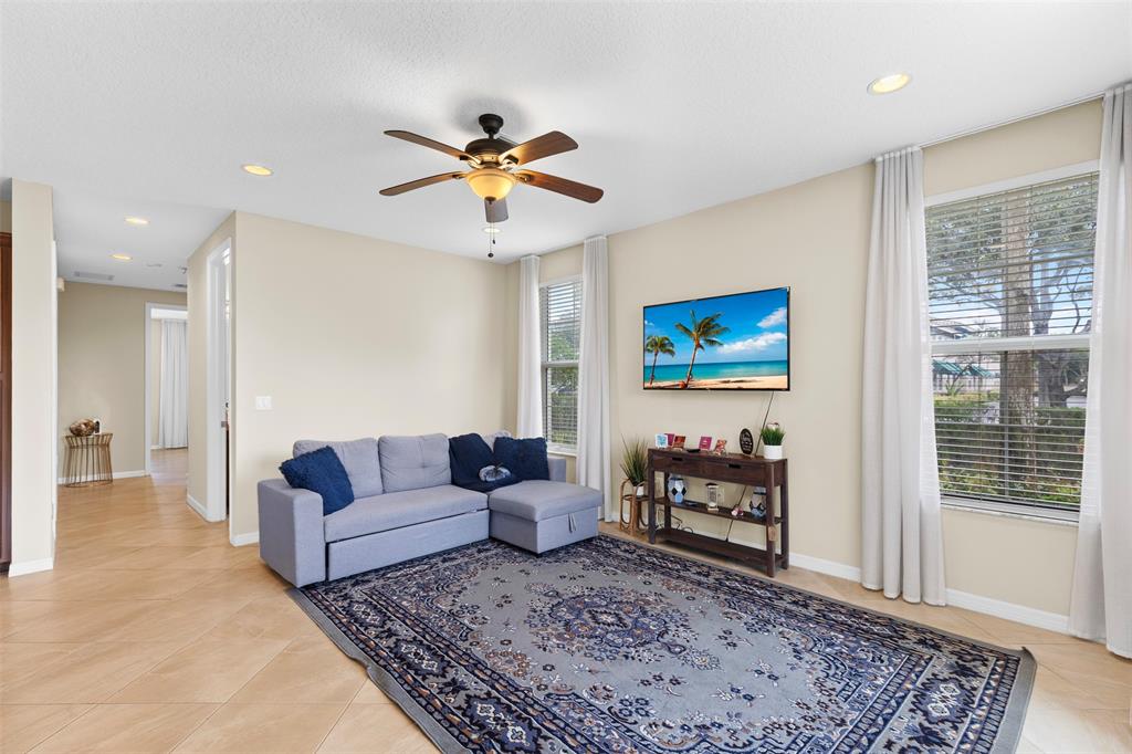 5224 Southwest 77th Way Davie, FL 33328 - Photo 14 of 43 a living room with furniture and a rug