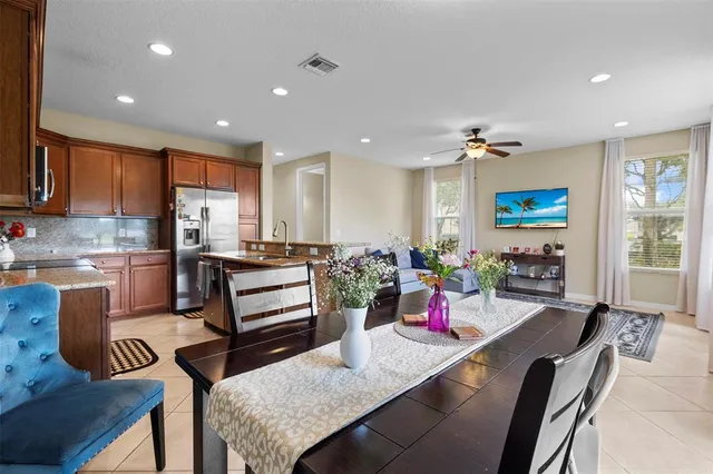a kitchen with a refrigerator and top table