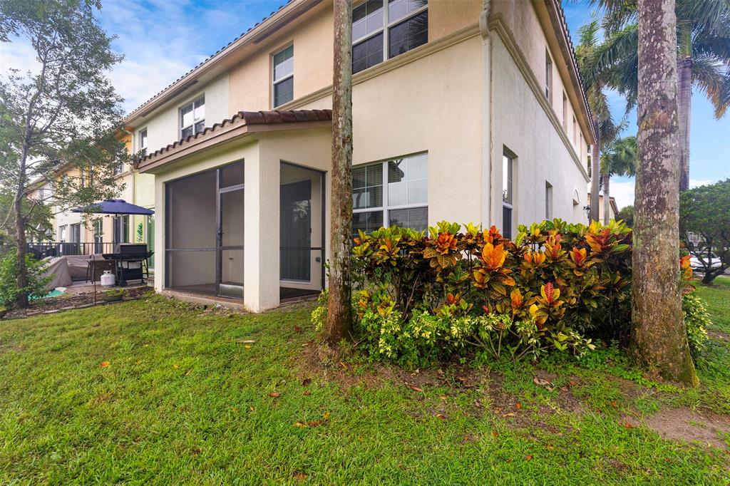 5224 Southwest 77th Way Davie, FL 33328 - Photo 29 of 43 a front view of a house with garden