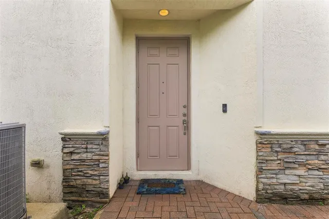 a view of walk in closet with clothes