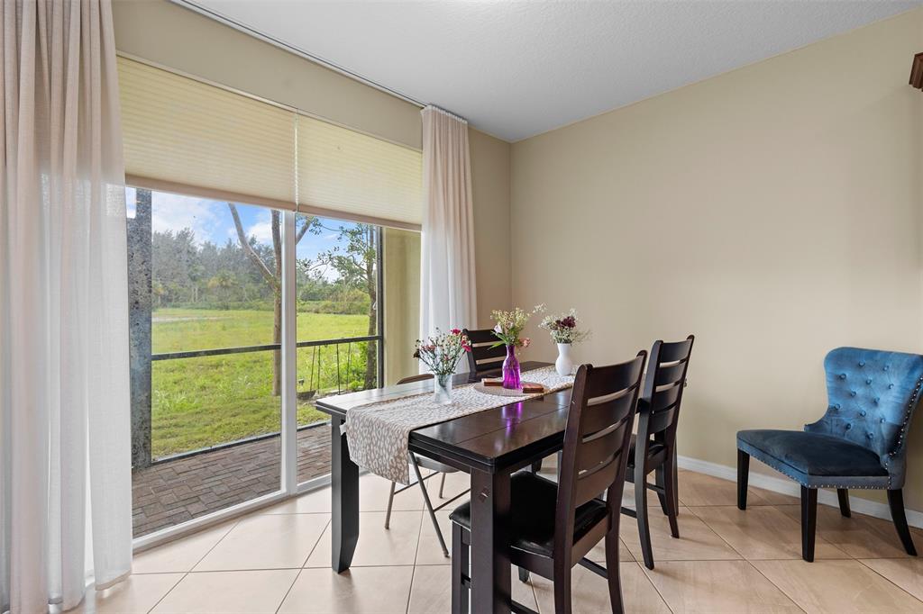 5224 Southwest 77th Way Davie, FL 33328 - Photo 33 of 43 a view of a dining room with furniture and a window