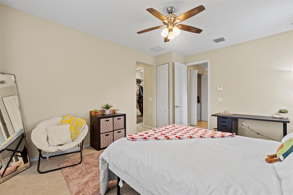 5224 Southwest 77th Way Davie, FL 33328 - Photo 36 of 43 a bedroom with a bed a dresser and chair