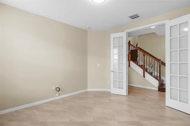 a view of an empty room with stairs