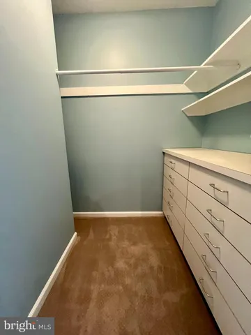 a view of a room with racks on the wall