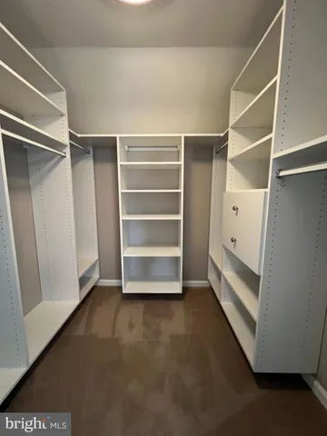 a view of an empty walk in closet
