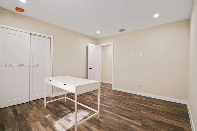 a room with a table and chairs