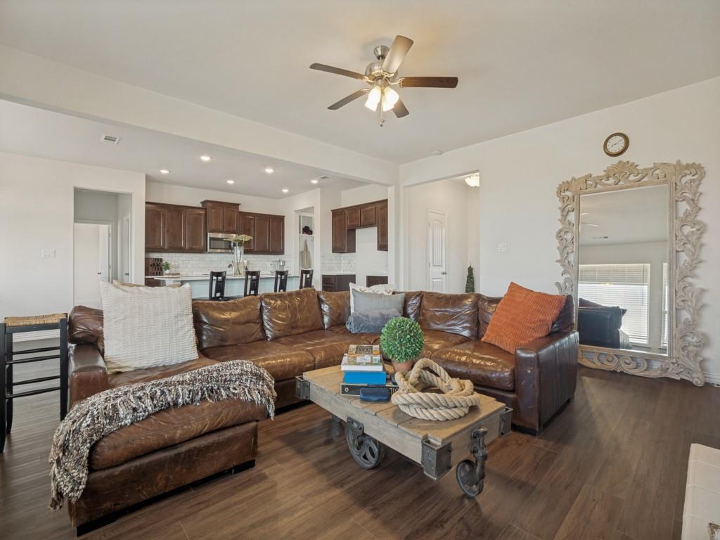 145 Prairie Trail Rhome, TX 76078 - Photo 8 of 25 Open-concept living area featuring wood-finish flooring, recessed lighting, and a ceiling fan