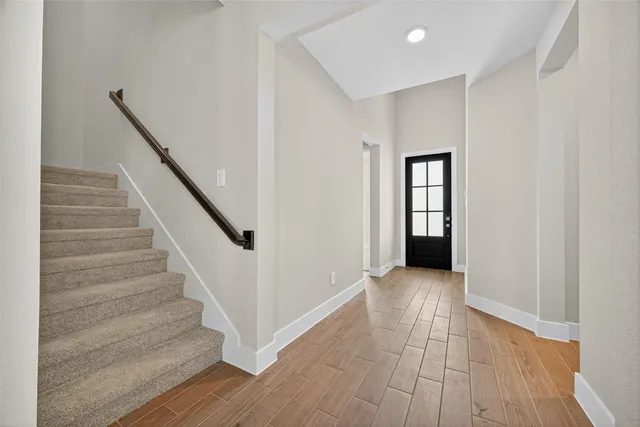 a view of entryway with wooden floor