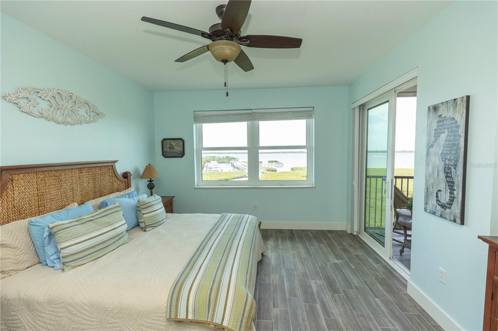 9203 Griggs Road, Unit D302 Englewood, FL 34224 - Photo 24 of 73 a bedroom with a bed and a window