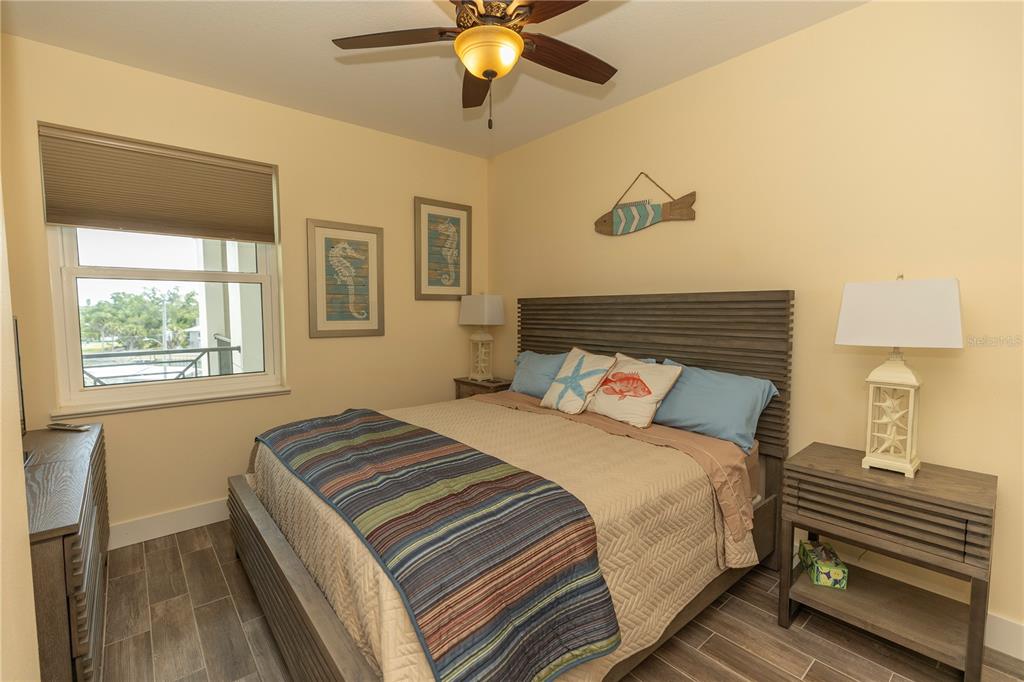 9203 Griggs Road, Unit D302 Englewood, FL 34224 - Photo 49 of 73 a bedroom with a bed and a window