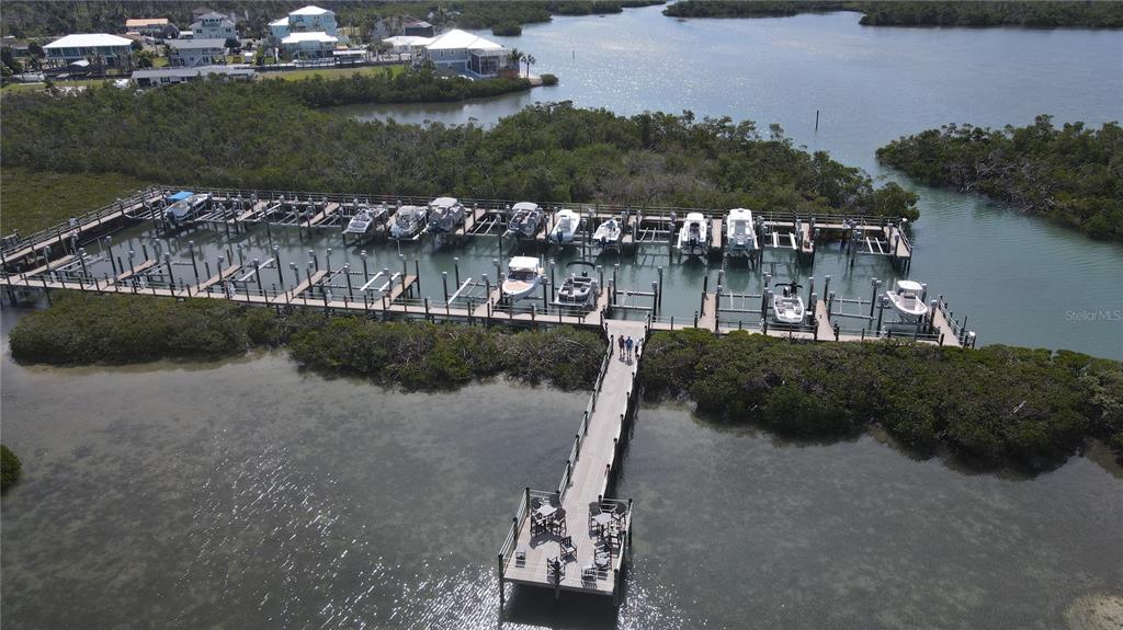 9203 Griggs Road, Unit D302 Englewood, FL 34224 - Photo 60 of 73 a view of a lake with a city