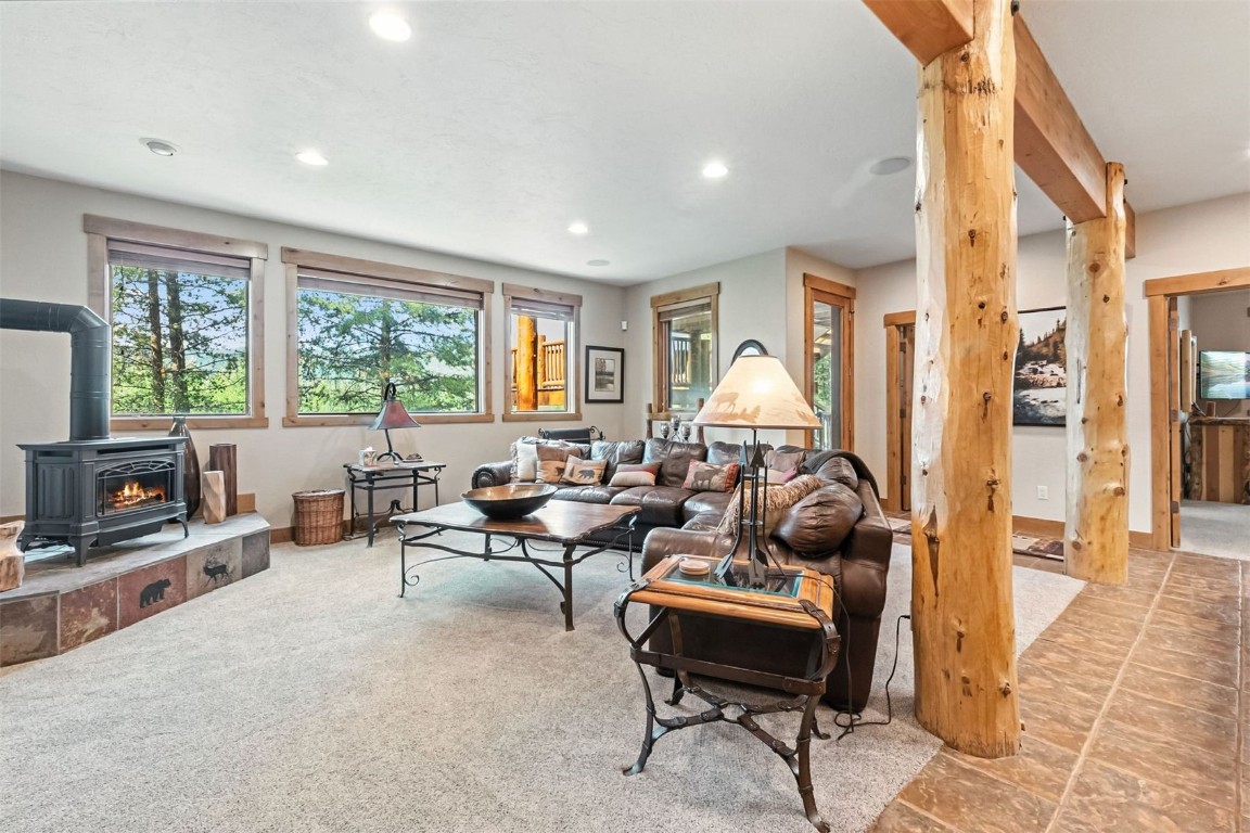 1730 Red Hawk Road Silverthorne, CO 80498 - Photo 11 of 50 a living room with furniture and a fireplace