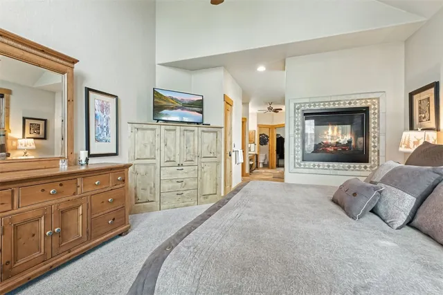 a spacious bedroom with a bed and a couch