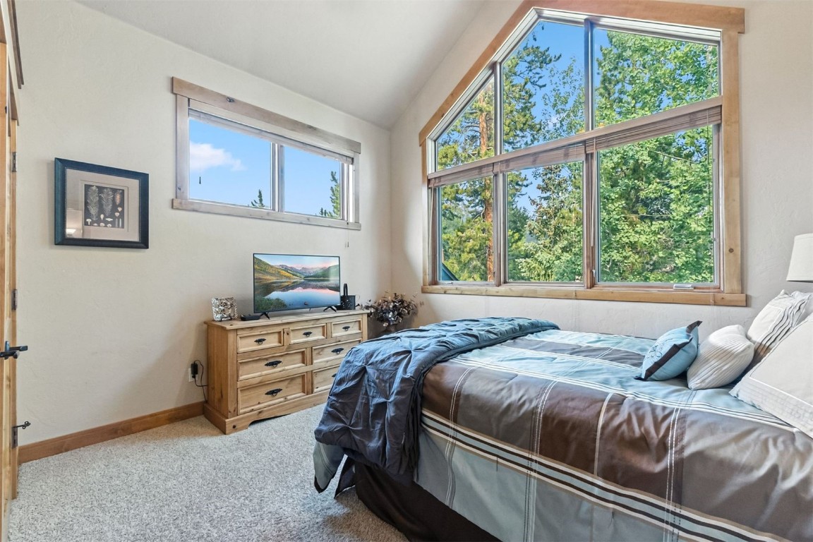 1730 Red Hawk Road Silverthorne, CO 80498 - Photo 24 of 50 a bedroom with a bed and a window