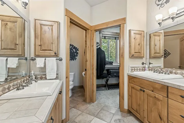 a bathroom with a sink a mirror and a bathtub