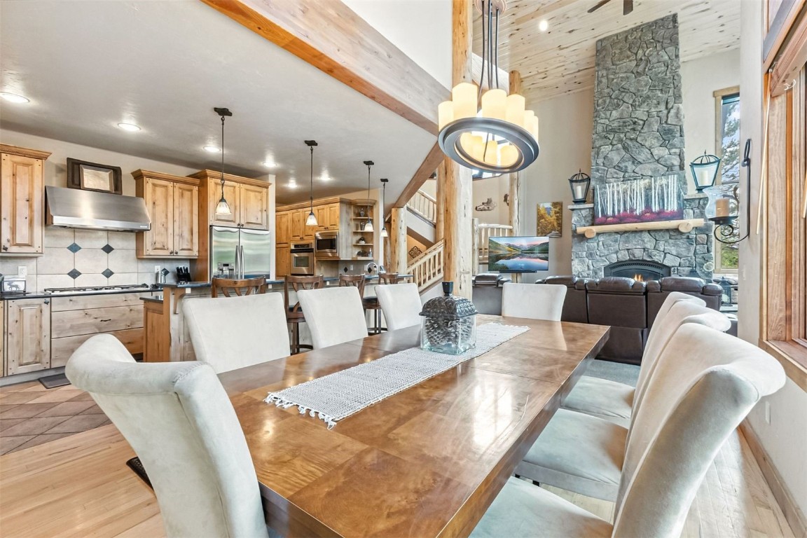 1730 Red Hawk Road Silverthorne, CO 80498 - Photo 4 of 50 a living room with fireplace furniture and a large window