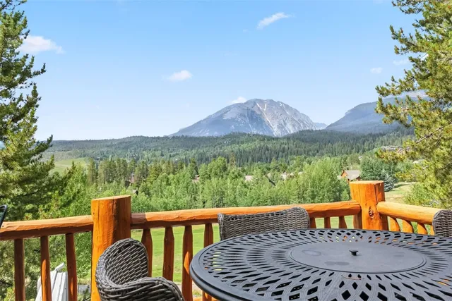 a view of a balcony with wooden floor