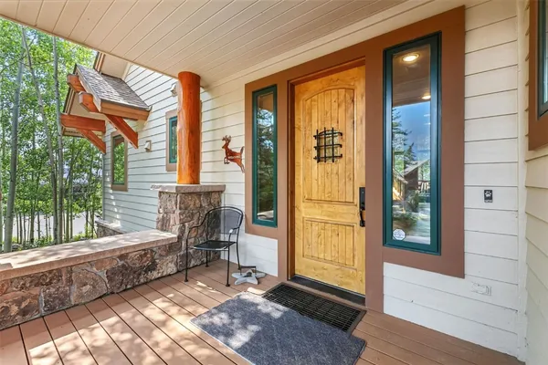 a front view of a house with outdoor seating