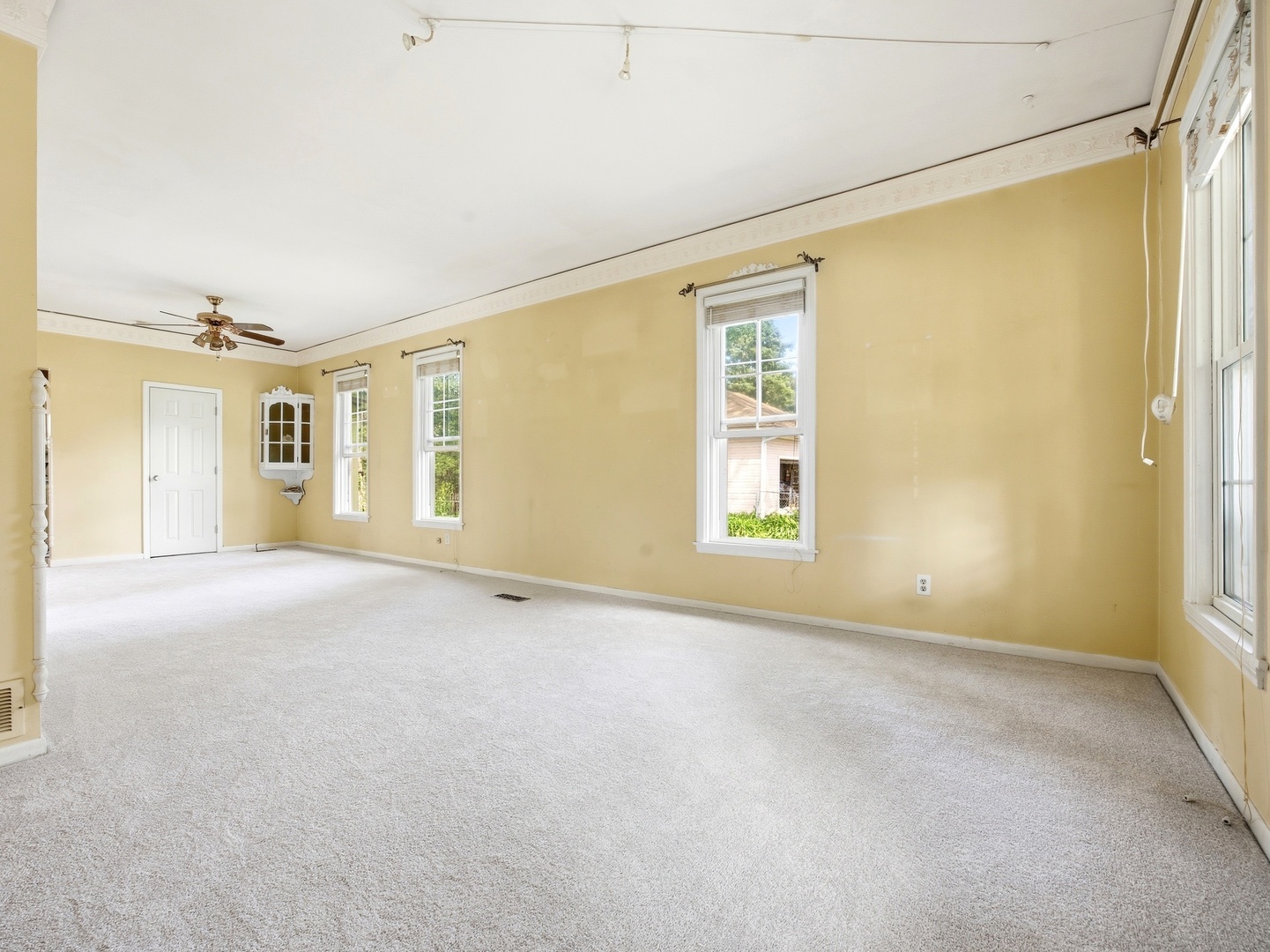 570 Addison Street Elgin, IL 60120 - Photo 5 of 17 an empty room with a empty space and windows