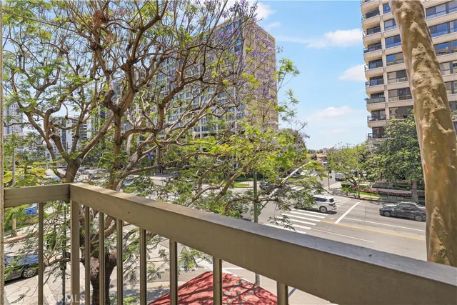 a view of balcony with wooden floor