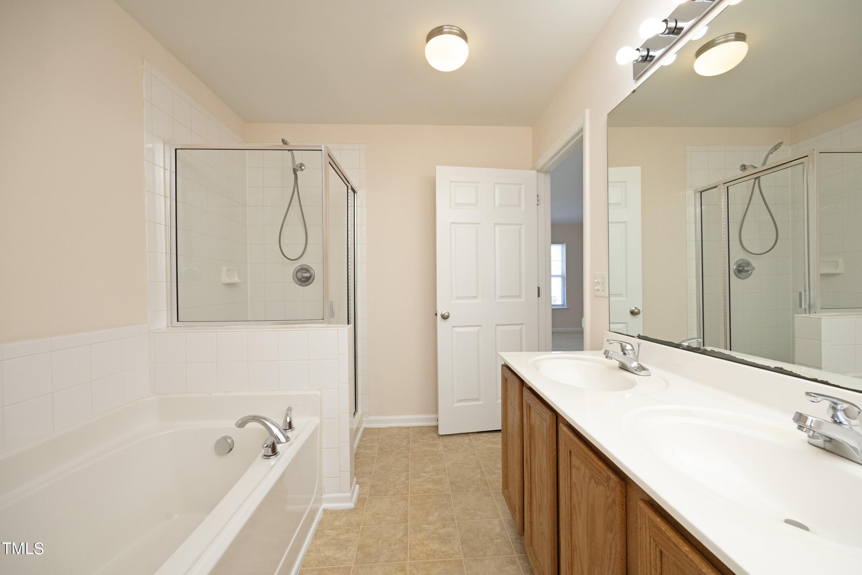 330 Gilman Lane, Unit 104 Raleigh, NC 27610 - Photo 18 of 28 17PrimaryBath