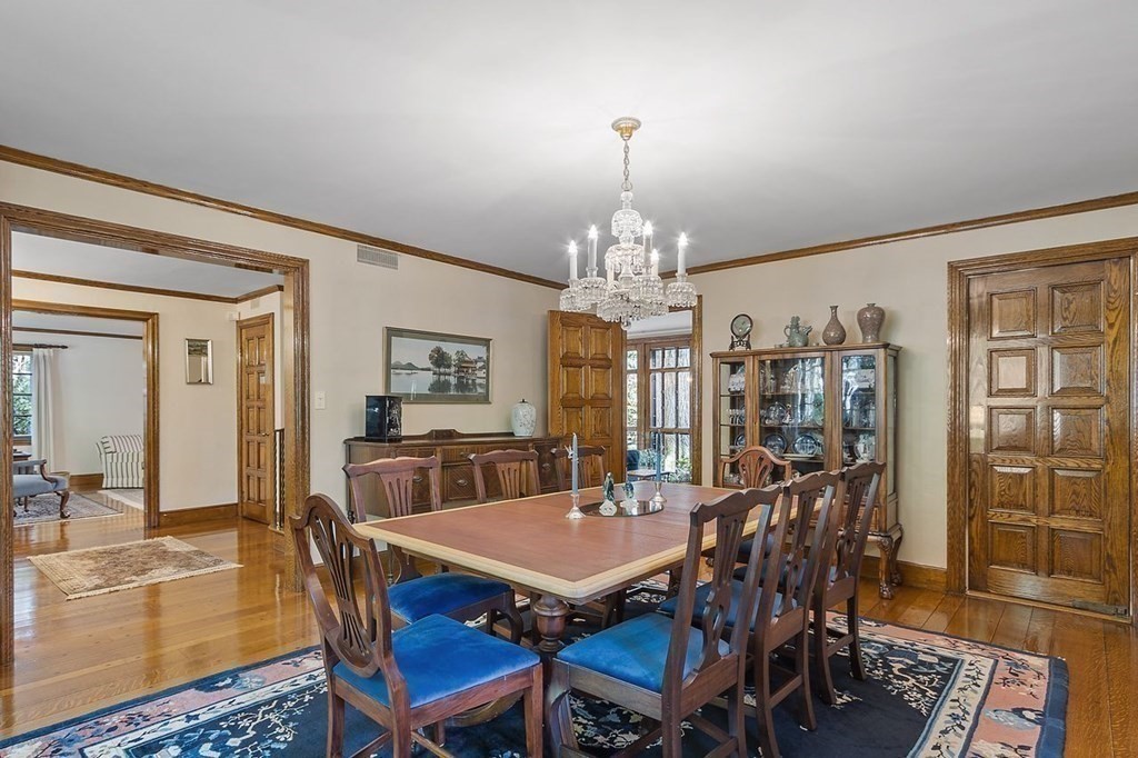 9 Aylesbury Road Worcester, MA 01609 - Photo 14 of 40 a view of a dining room with furniture a chandelier and wooden floor