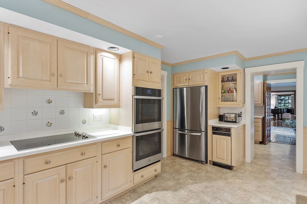 9 Aylesbury Road Worcester, MA 01609 - Photo 24 of 40 a kitchen with cabinets and stainless steel appliances