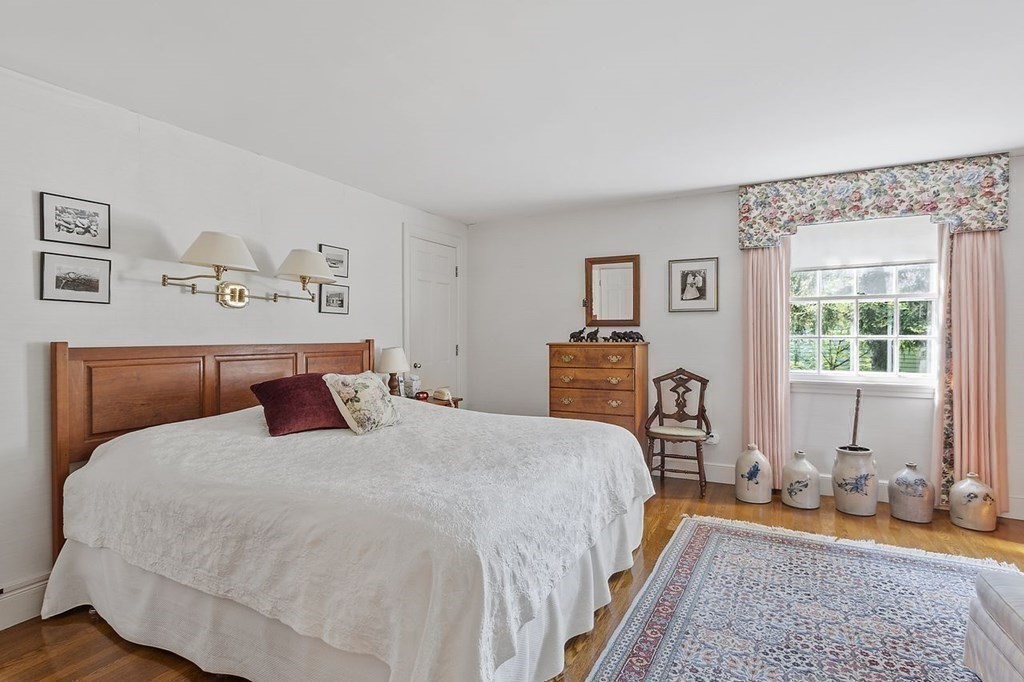 9 Aylesbury Road Worcester, MA 01609 - Photo 30 of 40 a bedroom with a bed and wooden floor