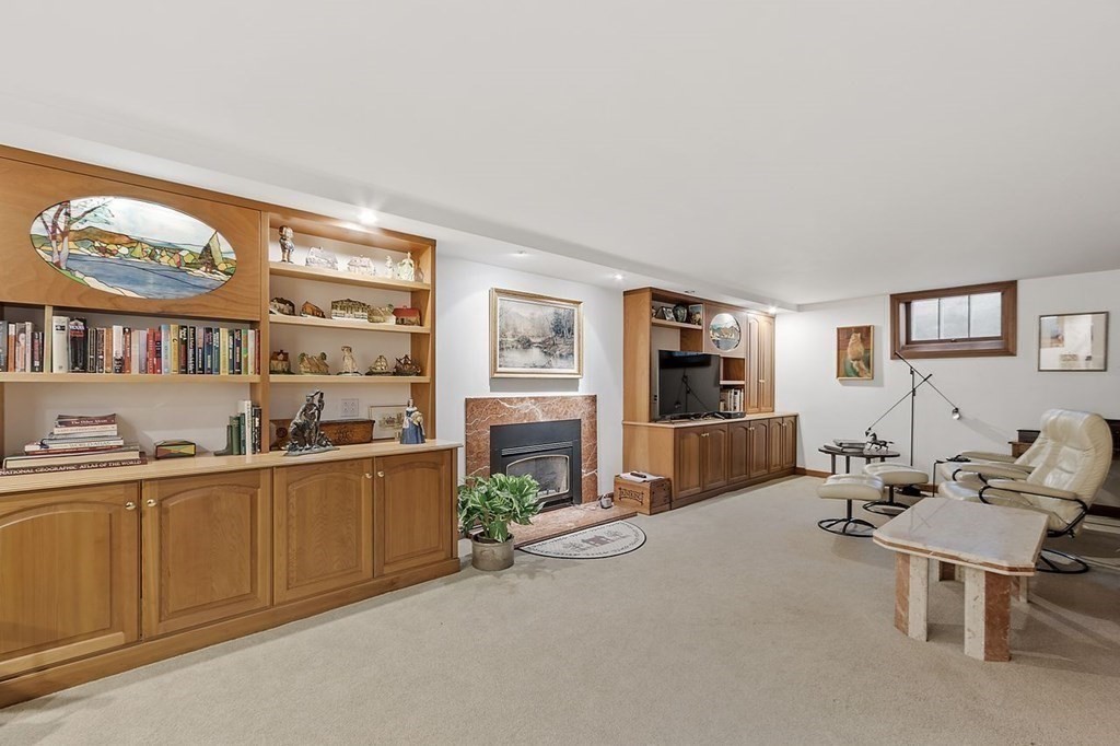9 Aylesbury Road Worcester, MA 01609 - Photo 34 of 40 a living room with furniture a window and a flat screen tv