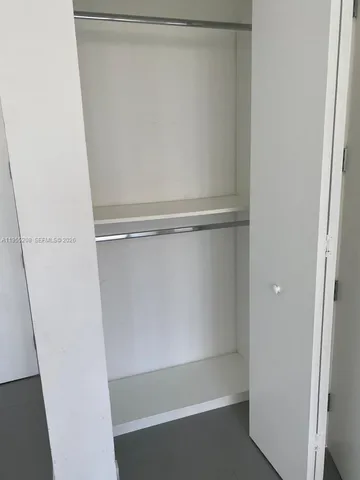 a front view of building with yard