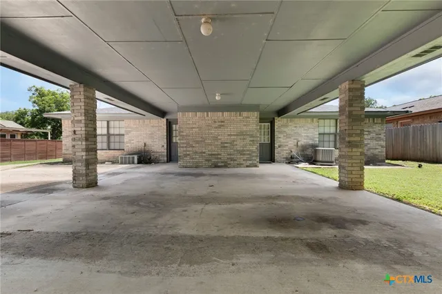 a view of backyard with large tree
