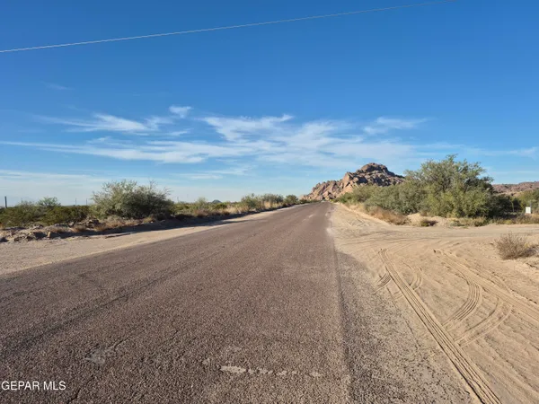 a view of a road with an ocean view