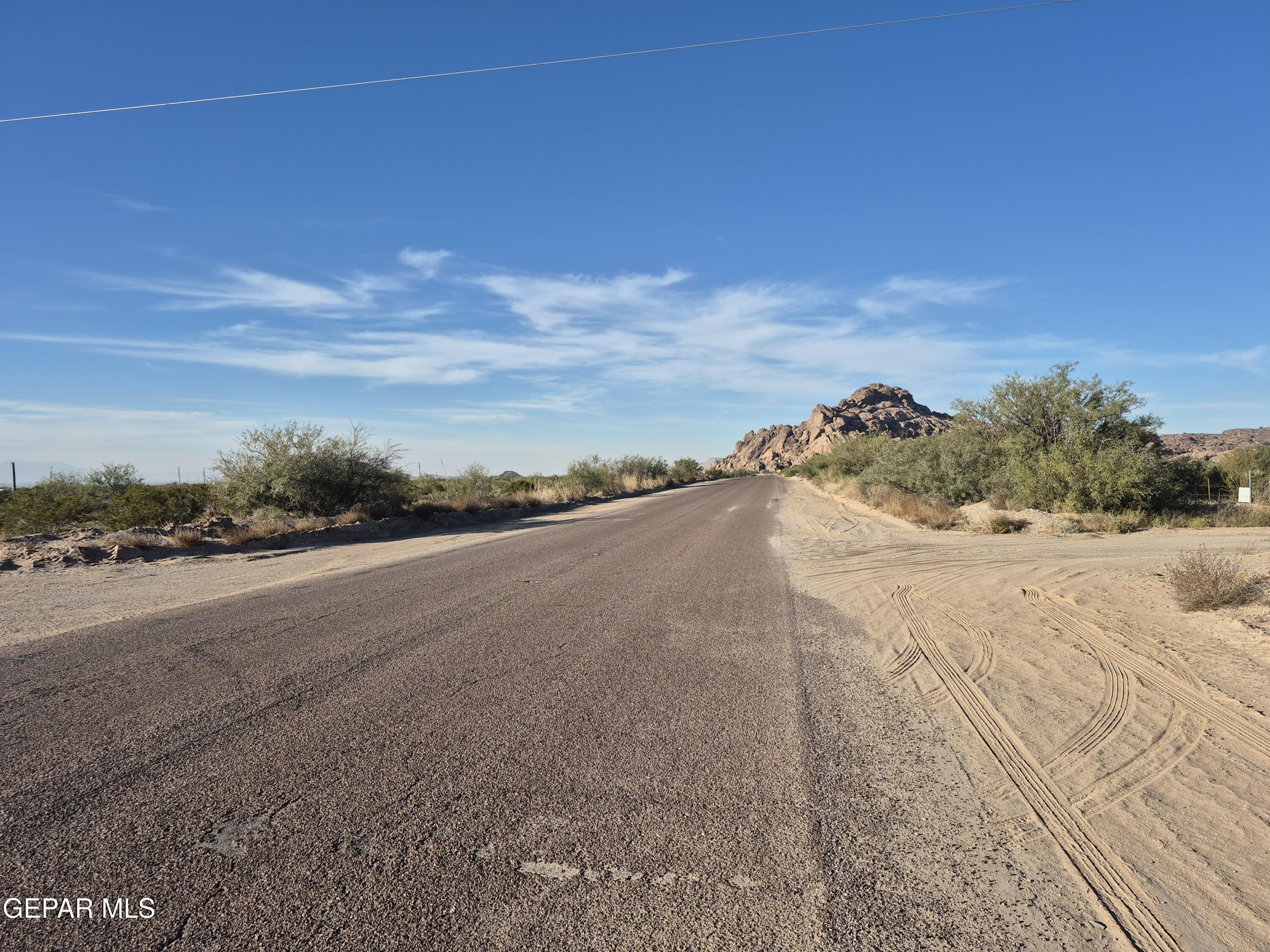 a view of a road with an ocean view