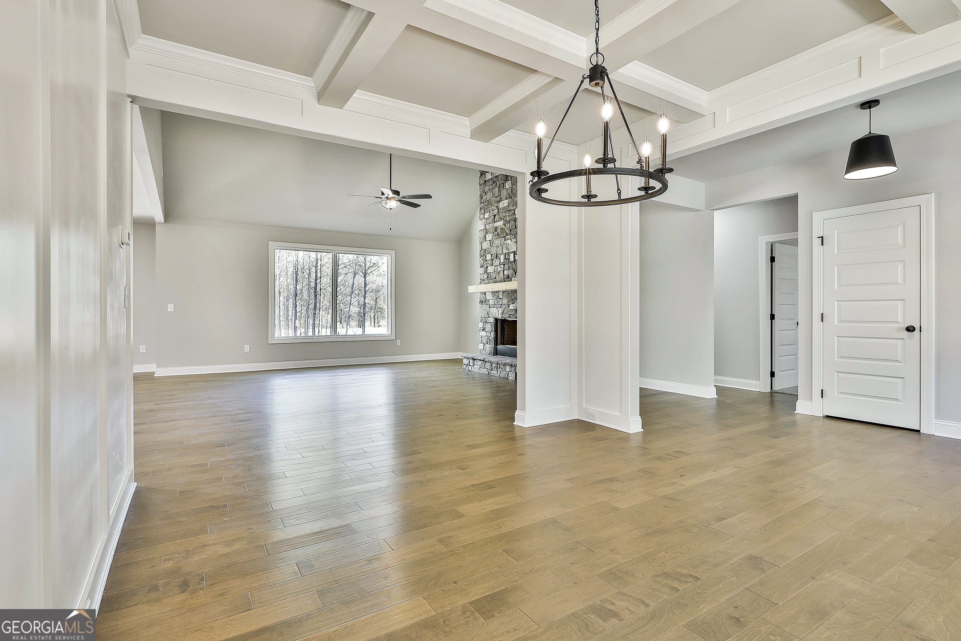 837 Alex Stephens Road Moreland, GA 30259 - Photo 13 of 50 a view of a room with wooden floor ceiling fan and windows